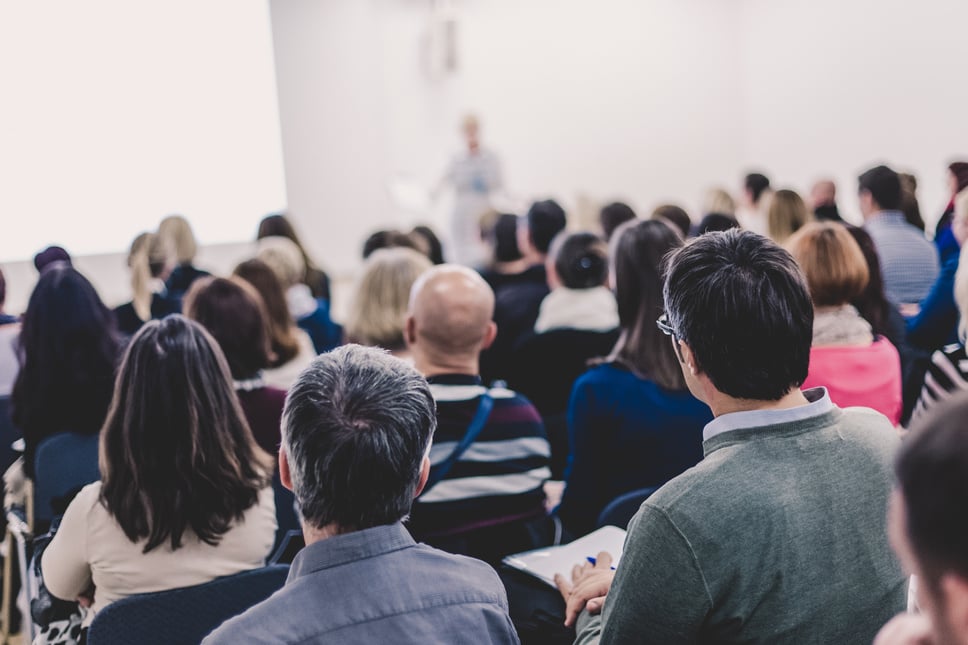 People Listening in a Presentation on a Business Conference